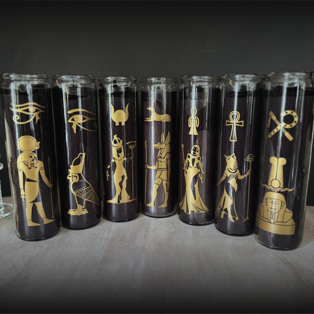 Seven black candles with Egyptian artwork